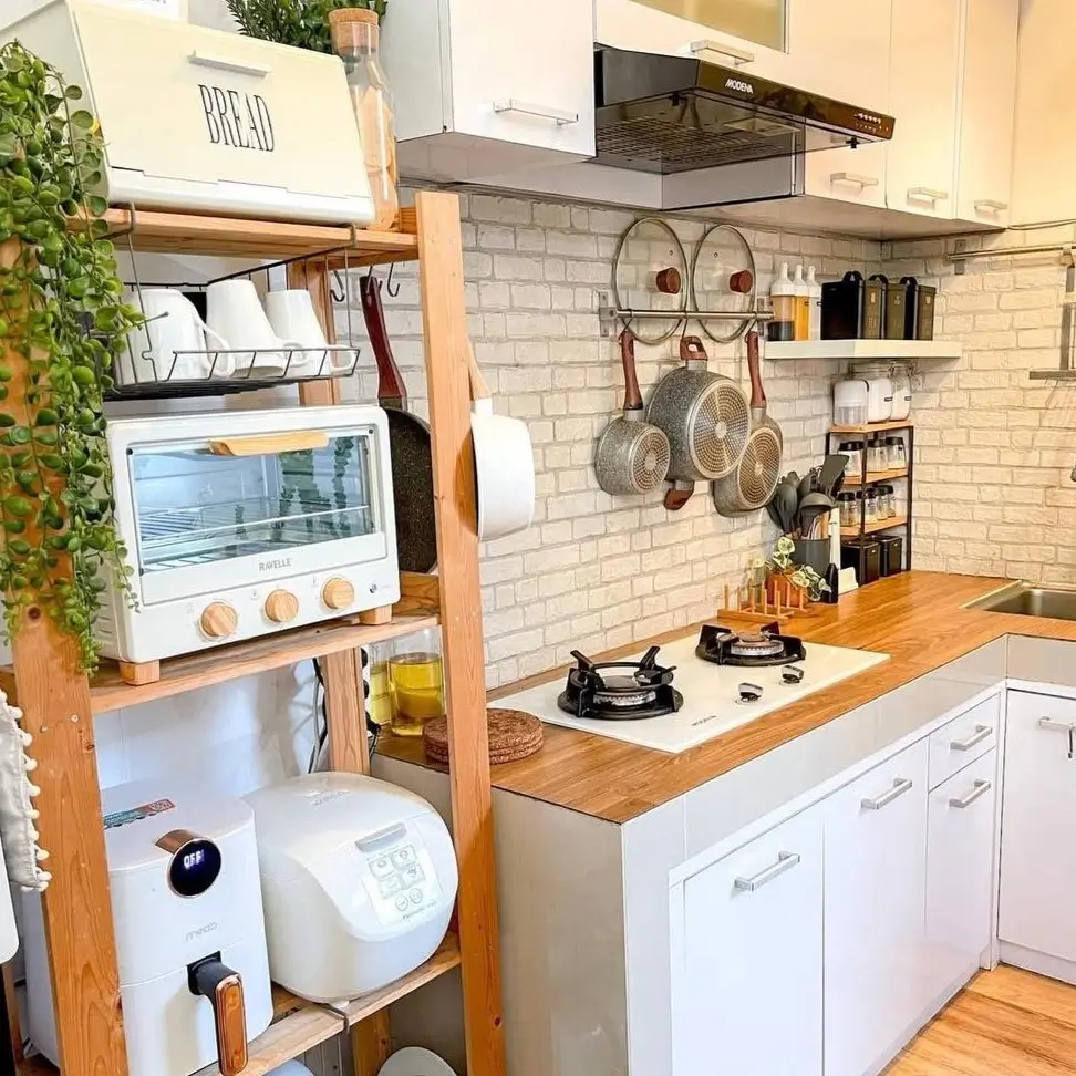 A tiny kitchen idea featuring a wooden baker's rack for appliance storage.