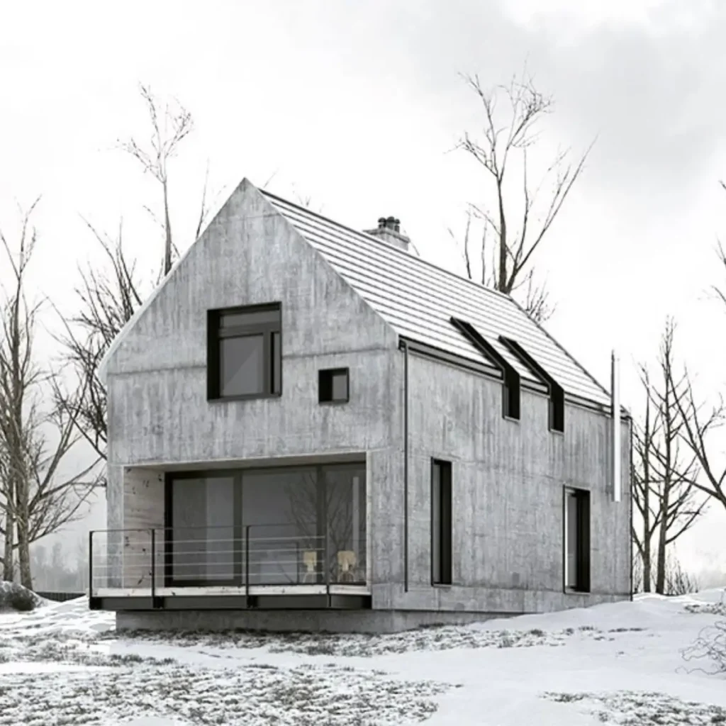 A modern brutalist house with a classic gabled roof, constructed from board-formed concrete and set against a stark, snowy landscape.