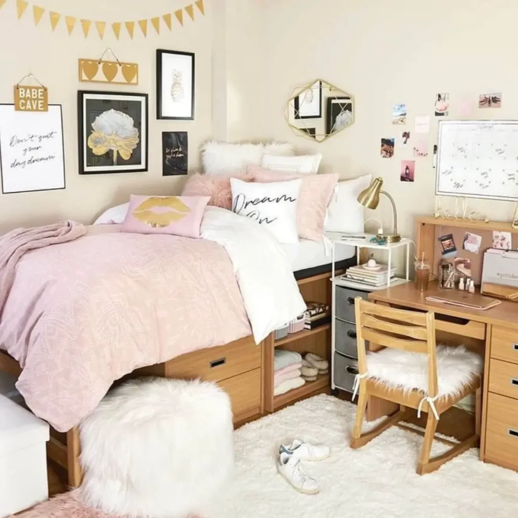 A cozy small bedroom idea featuring a lofted bed with storage, a wooden desk, and a gallery wall with pink and gold accents.