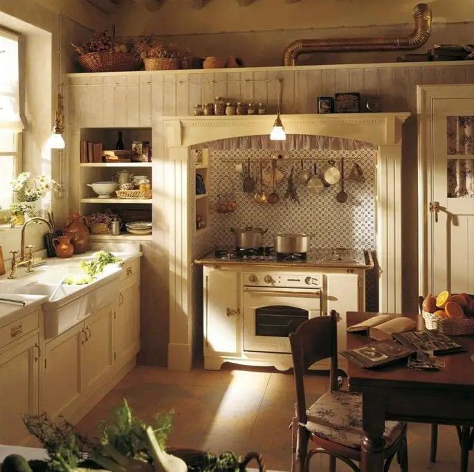 A rustic English country kitchen with a freestanding range cooker, a deep farmhouse sink, and hanging copper pots.