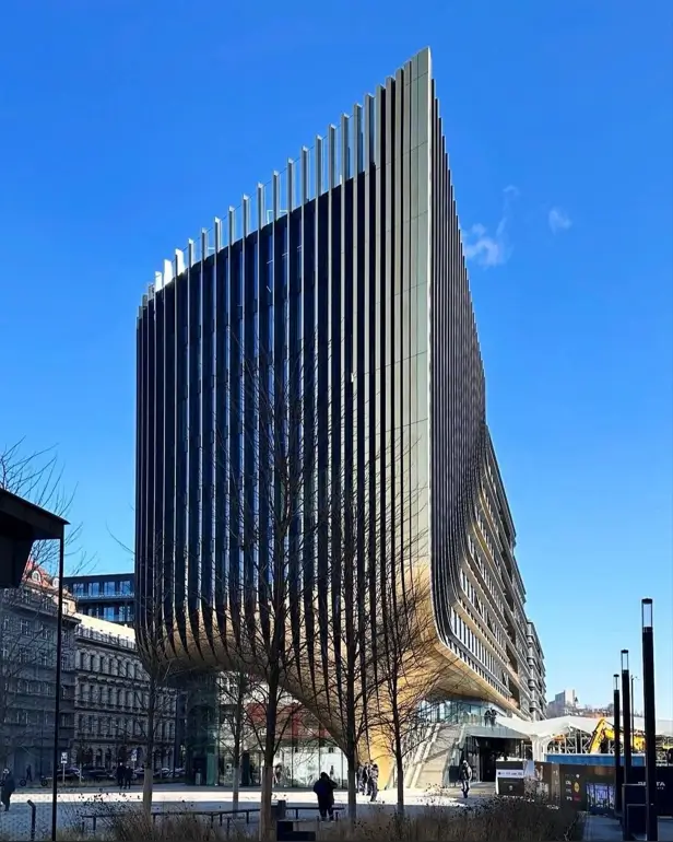 Architectural concept of a building with a rhythmic facade of vertical fins that create texture and shadow.