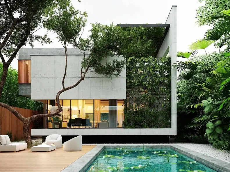 A modern concrete home featuring a vertical garden and a poolside deck, surrounded by lush trees.