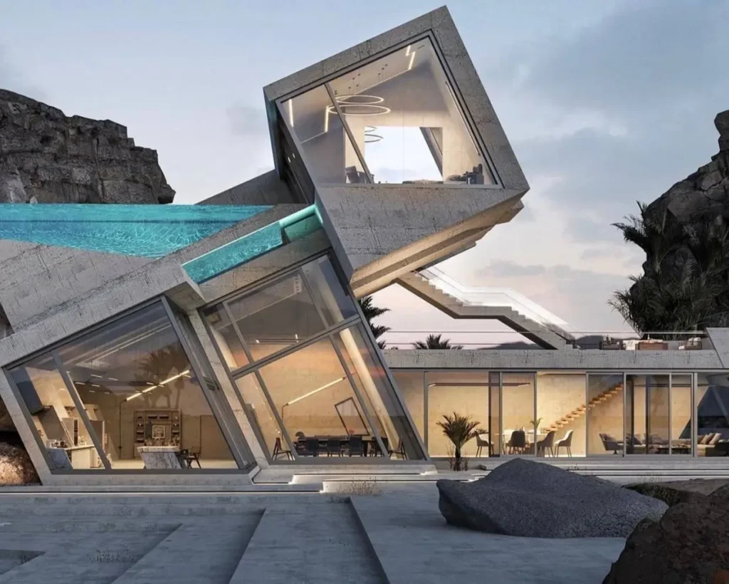 A dramatically angular concrete brutalist house with a glass-walled cantilevered swimming pool, jutting out from a rugged, rocky cliffside.
