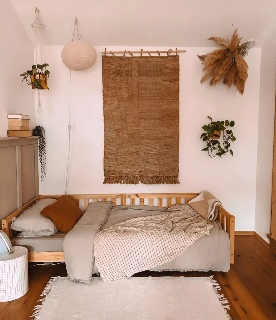 Bedroom with woven wall hanging.