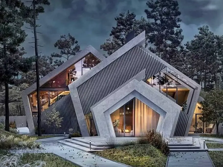 A dramatic, angular modern concrete house with large geometric windows, illuminated at night in a forest setting.