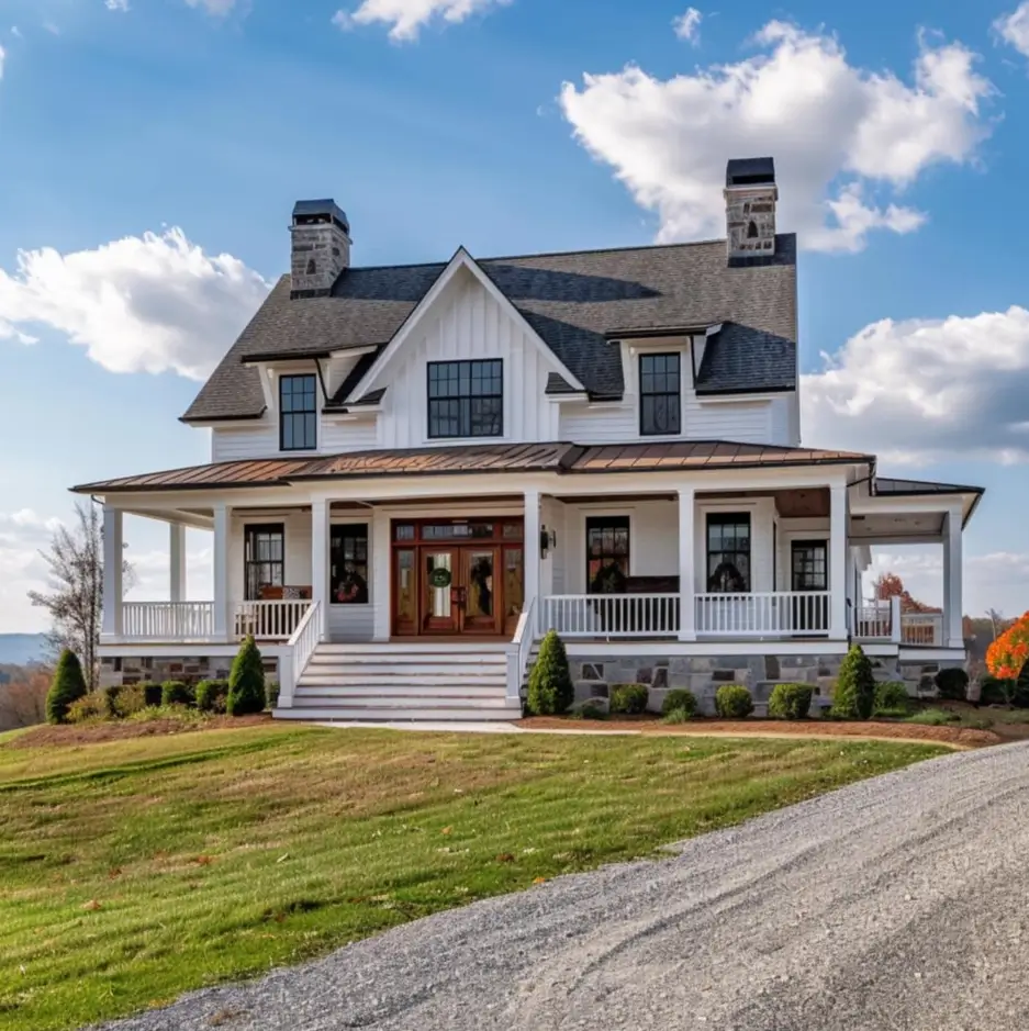 A stately modern white farmhouse with a wraparound porch, two large stone chimneys, and a copper accent roof, sitting on a grassy hill.