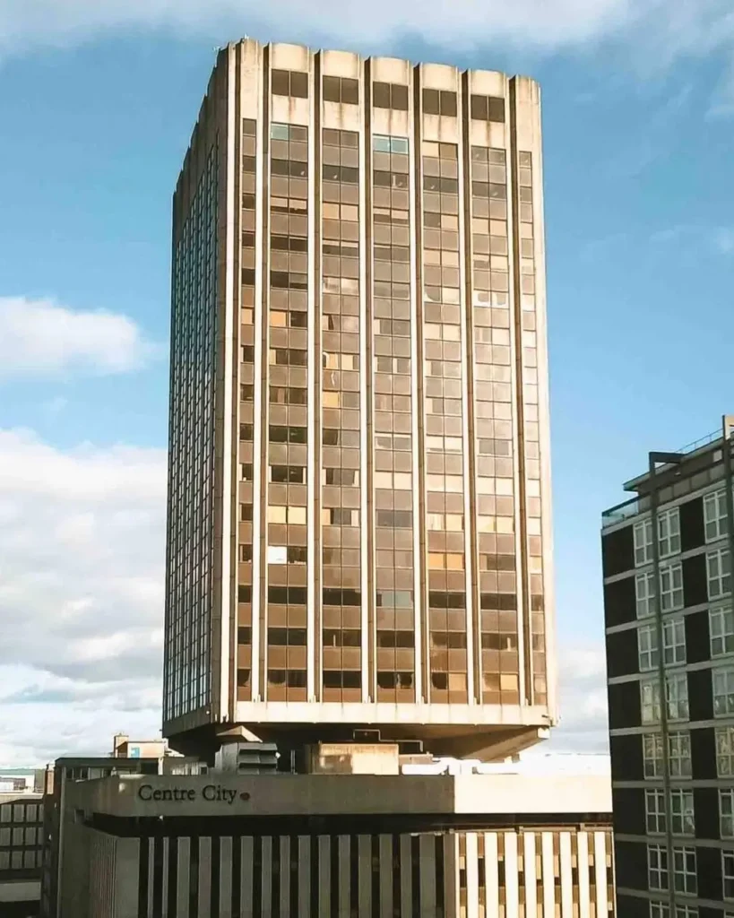 A bold Brutalist architectural idea featuring a top-heavy, cantilevered tower over a smaller base.