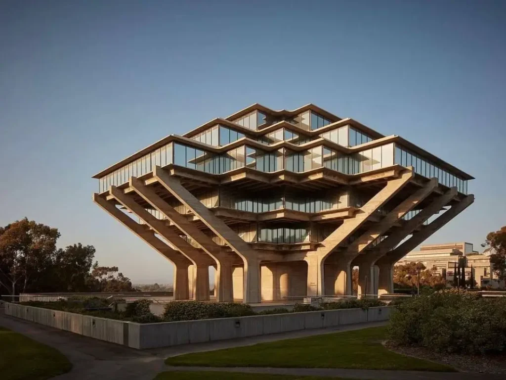 The iconic Geisel Library, a landmark of architect Brutalism, with its striking cantilevered concrete structure and geometric glass panels.