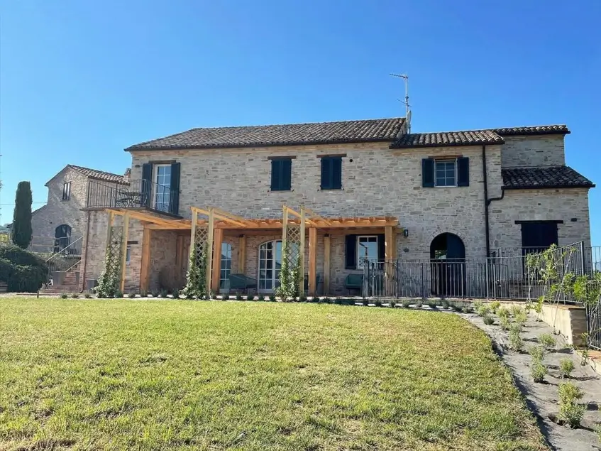 rustic italian countryside home with pergola