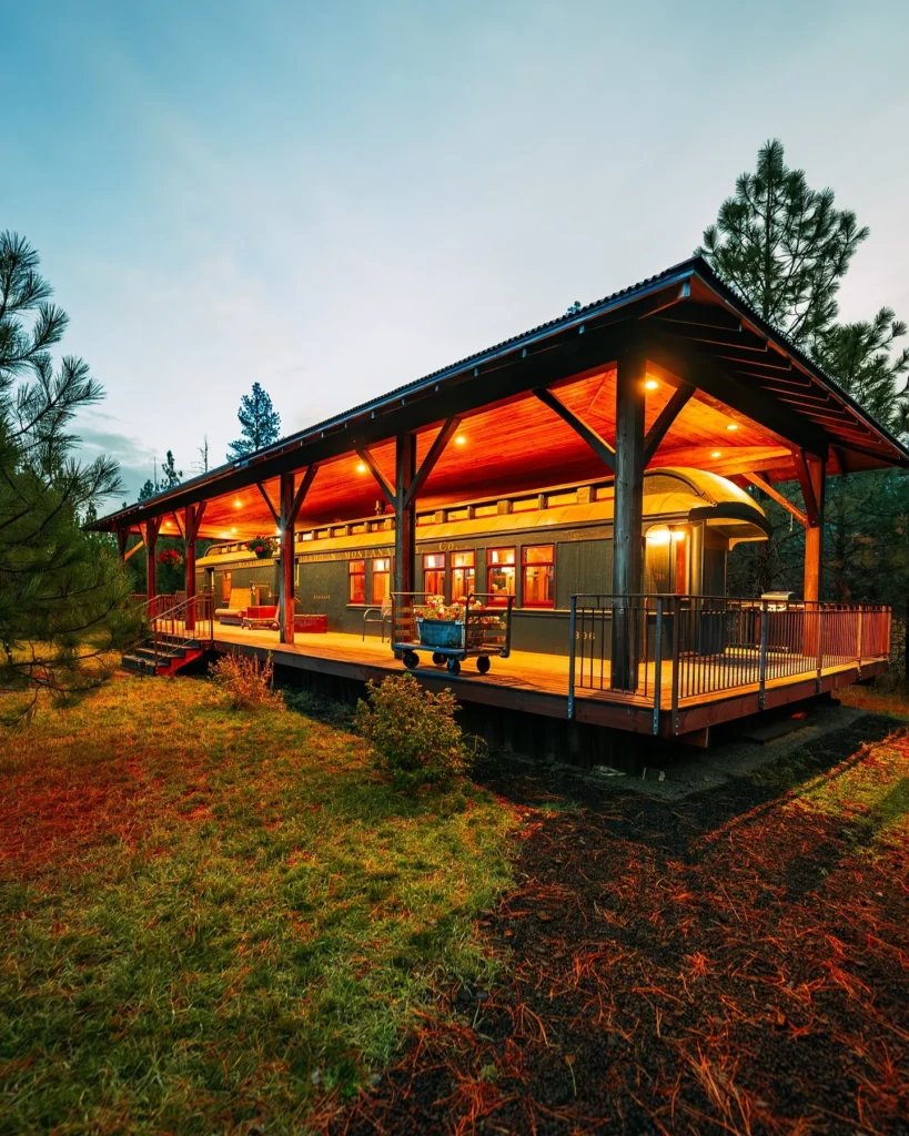 Stunning house design with large wrap-around wooden porch.