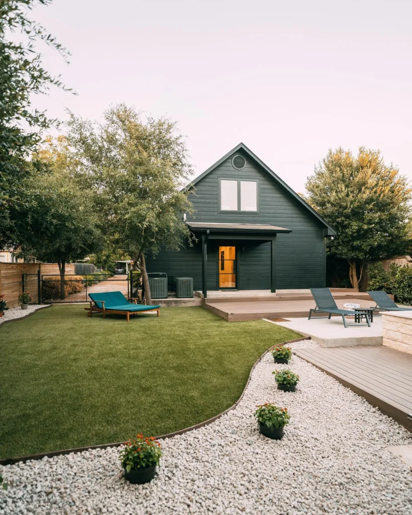 Stunning house design with modern backyard landscaping.