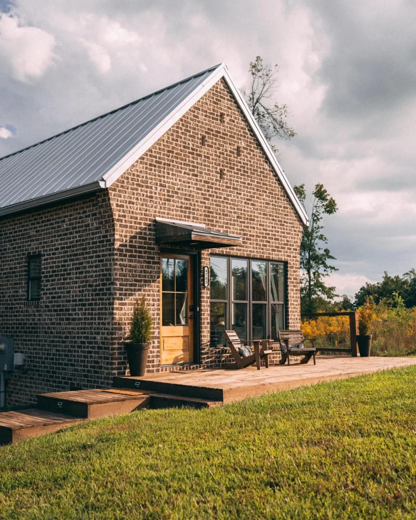 Luxury mountain cottage stunning house design with brick exterior.