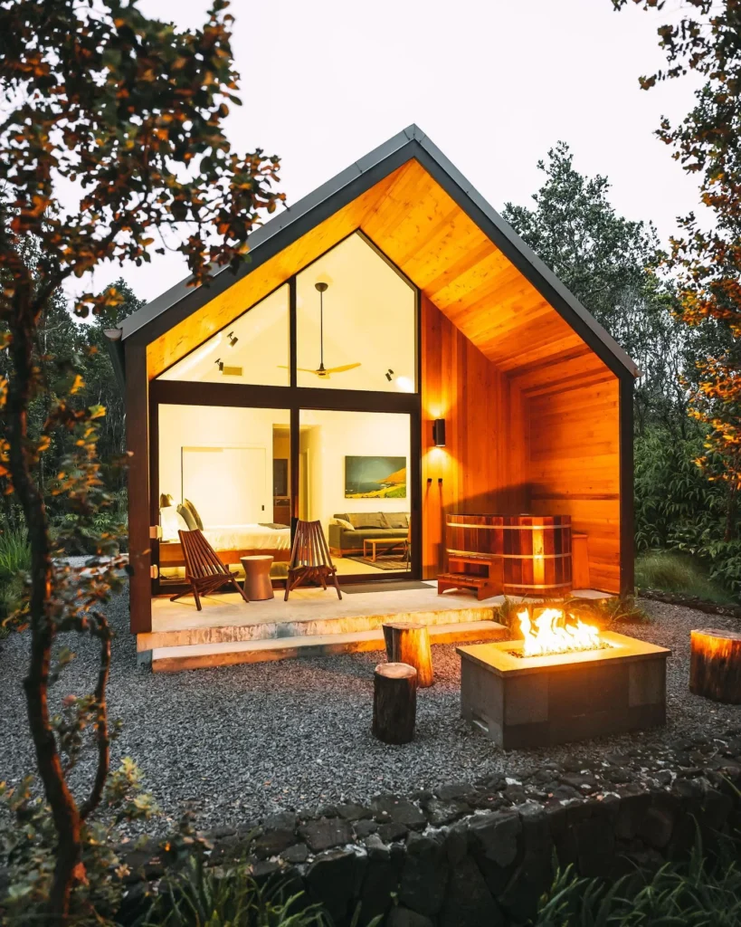 Tiny house stunning design with warm wood exterior and outdoor soaking tub.