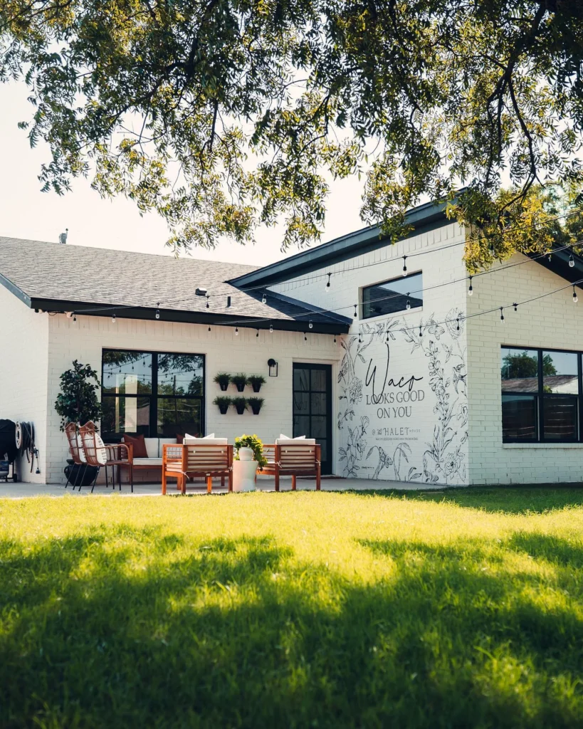 Stunning house designs with white brick and playful mural in Waco.