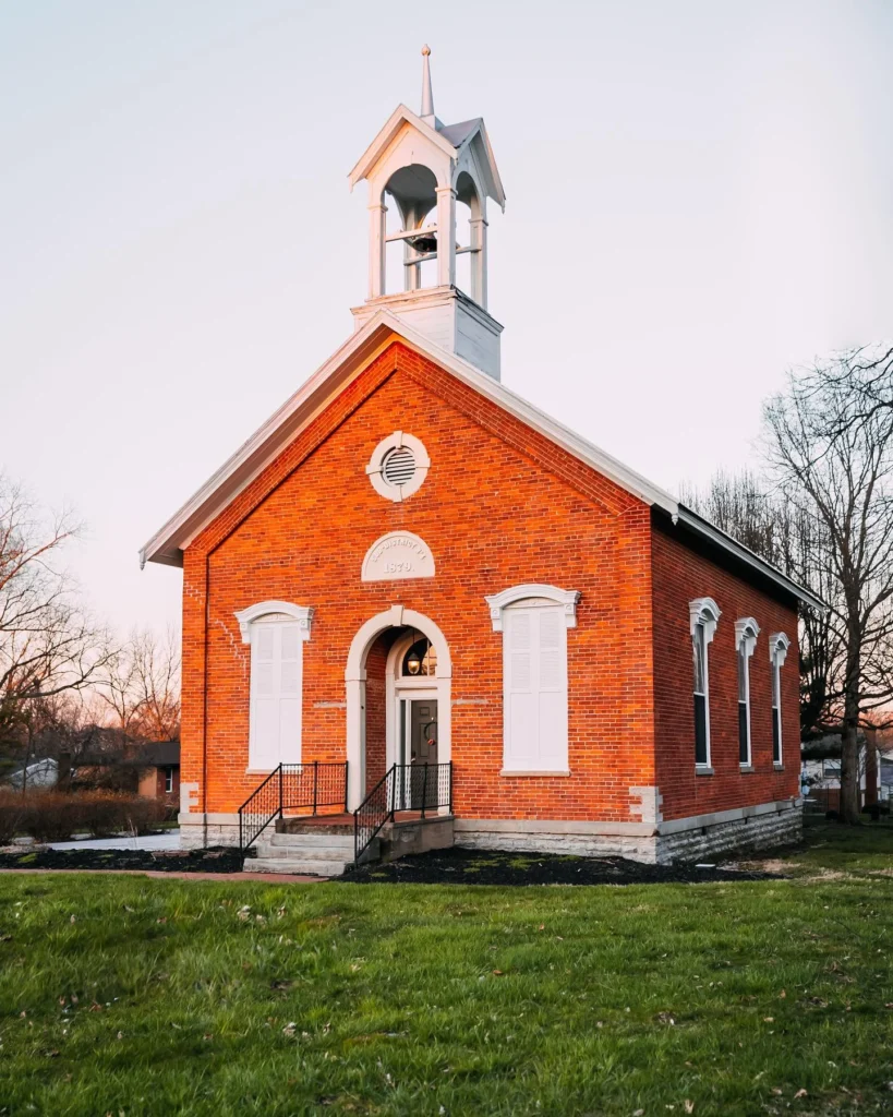 Historic brick stunning house design with bell tower.