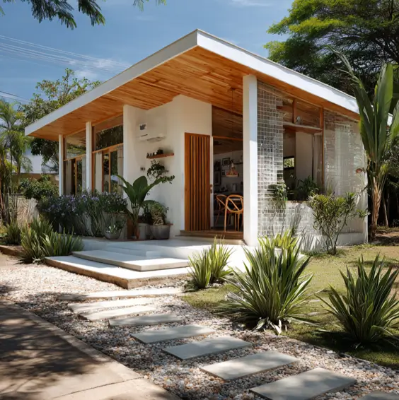 36 Tiny House Design Ideas + An Expert Interior Guide for 2025 39 A modern white tiny house with a flat roof, wood accents, and large windows.