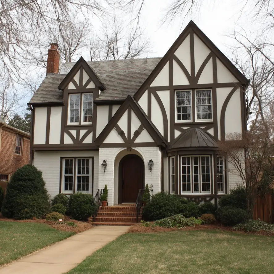 Classic Tudor-style house exterior featuring intricate dark brown half-timbering and a prominent bay window.