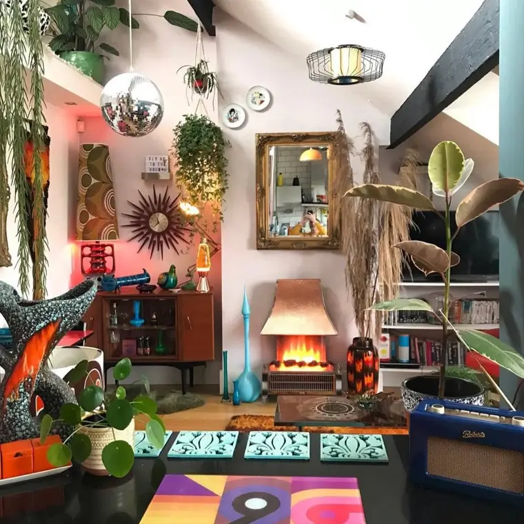 A maximalist living room with 70s interior decor, including a disco ball, lava lamp, and starburst clock.