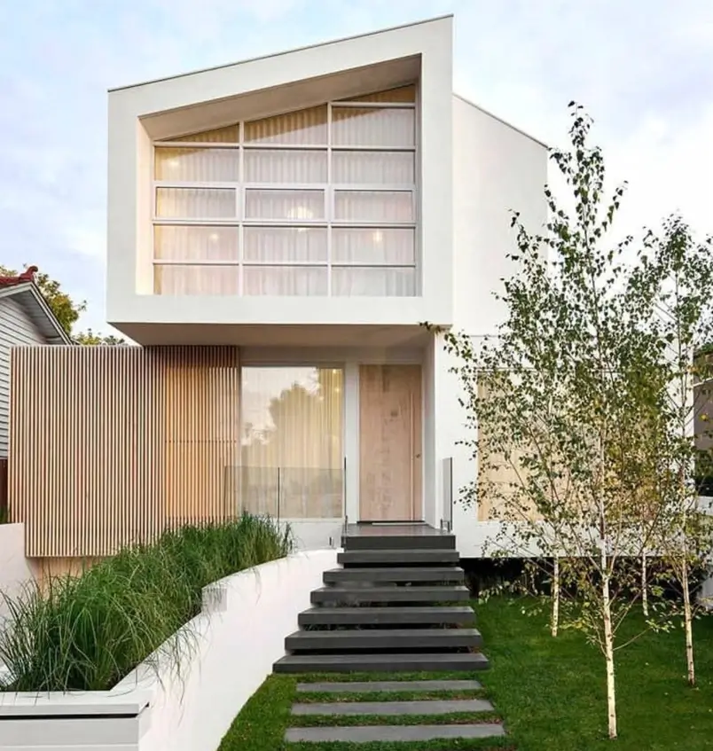 A Japanese style house modern exterior with white walls, a wood slat screen, and large windows.