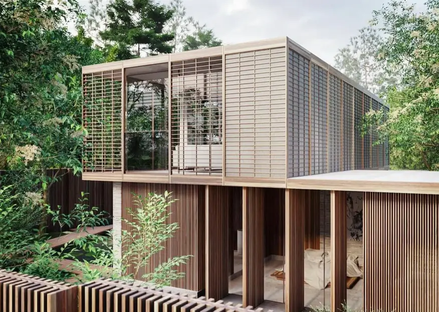A modern Japanese house exterior elevated in trees with fine wooden latticework screens.
