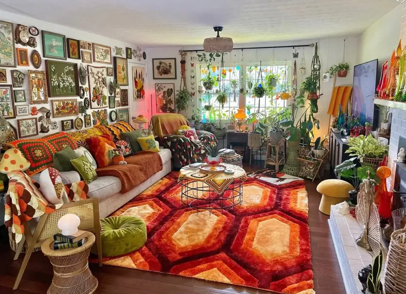 A maximalist 70s living room with a large gallery wall, a geometric rug, and many plants.