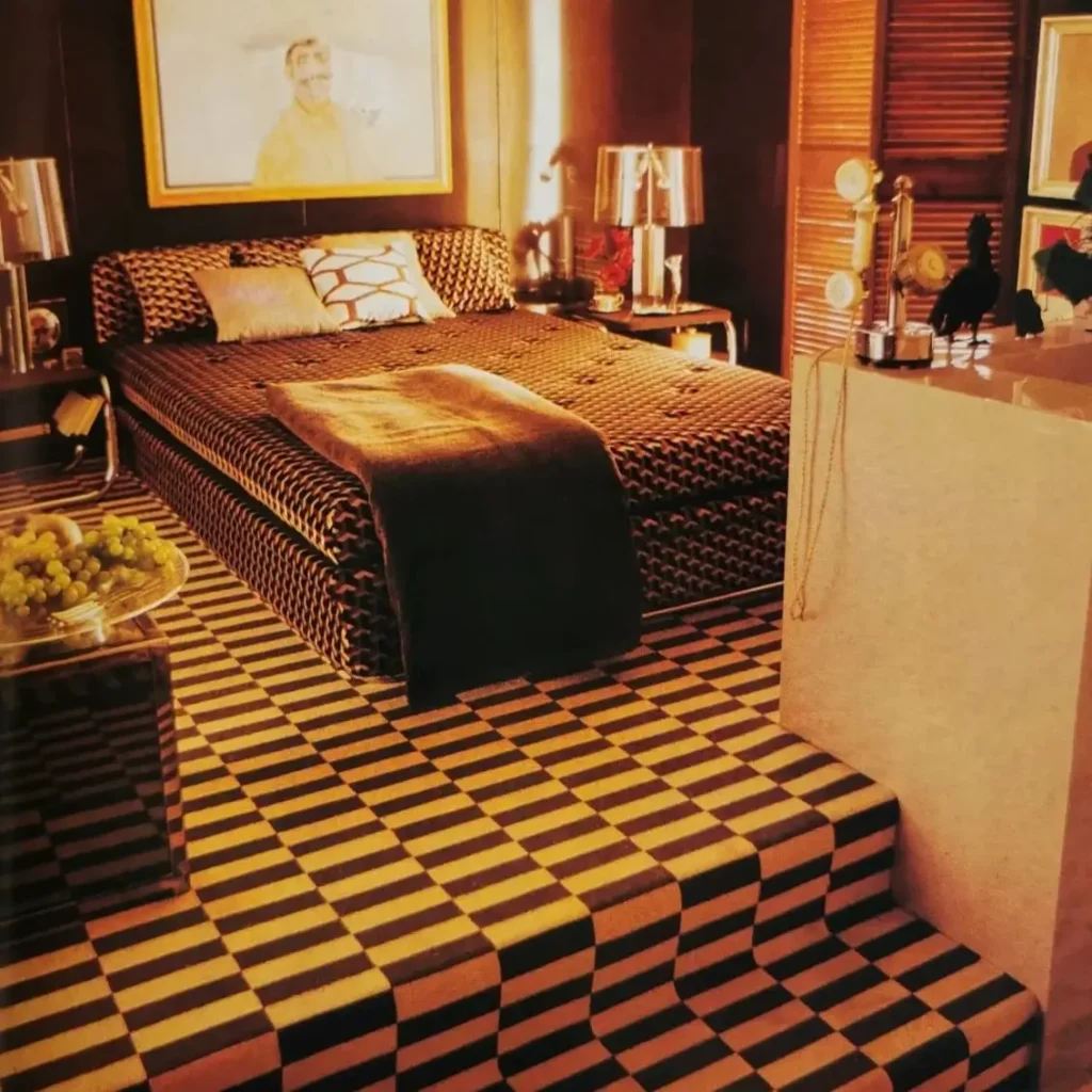A glamorous 70s bedroom with a bold black and yellow checkerboard carpet that extends up a set of stairs.