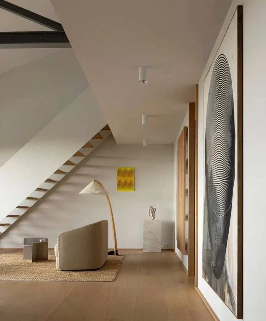 The Japandi-style Holmen Abode by Norm Architects, featuring a sculptural minimalist steel staircase and curated art.