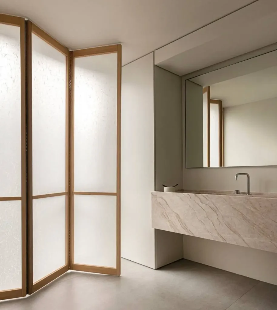 A serene minimalist bathroom in Copenhagen by Norm Architects, featuring a light-diffusing Shoji screen.