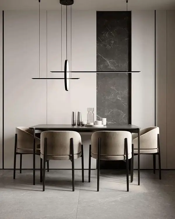 A modern condo dining room design idea with a black rectangular table, beige chairs, and a striking linear pendant light.