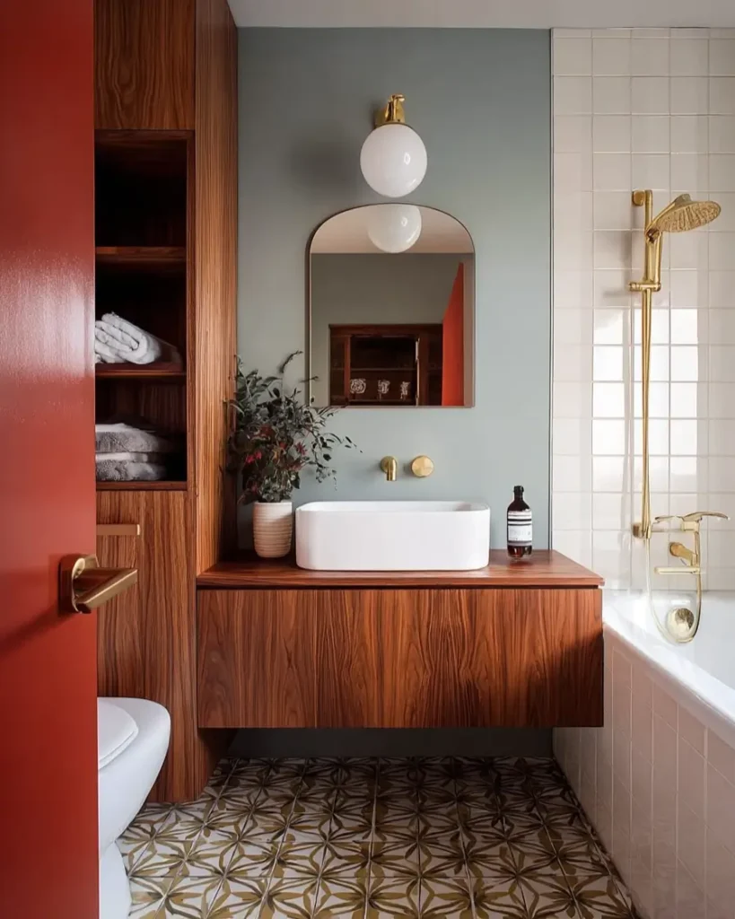 43 Mid Century Modern Small Bathroom Ideas for a Timeless Oasis (2025) 12 Floating walnut vanity with patterned floor tiles and sage green walls.