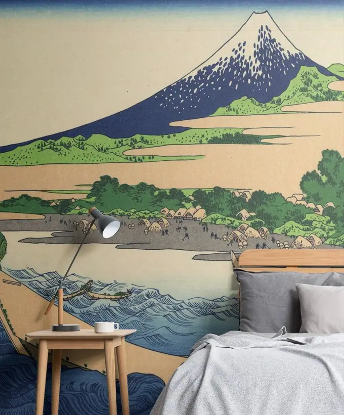 A Japanese-style bedroom with a large wall mural of a Mount Fuji ukiyo-e print behind a simple bed.