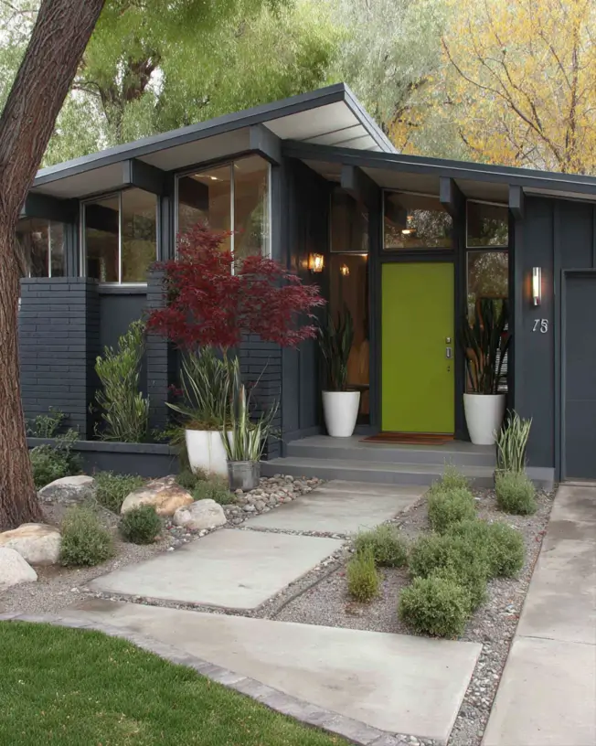 37 Mid Century Modern House Exteriors to Inspire Your Renovation 14 A mid century modern home exterior with dark charcoal painted brick and a vibrant chartreuse-green front door.