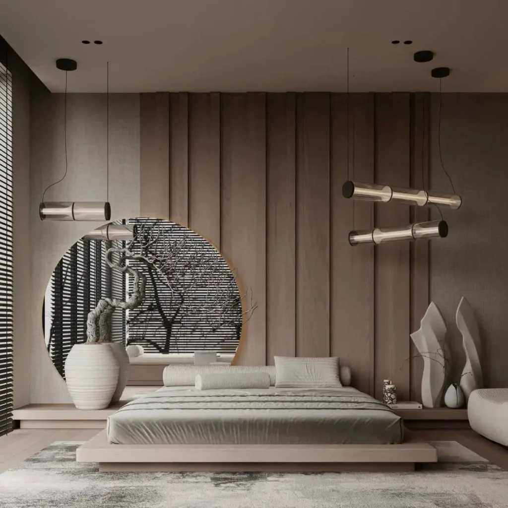 A modern Japandi bedroom with a wood-paneled wall, a low platform bed, a large circular art piece, and abstract sculptures.