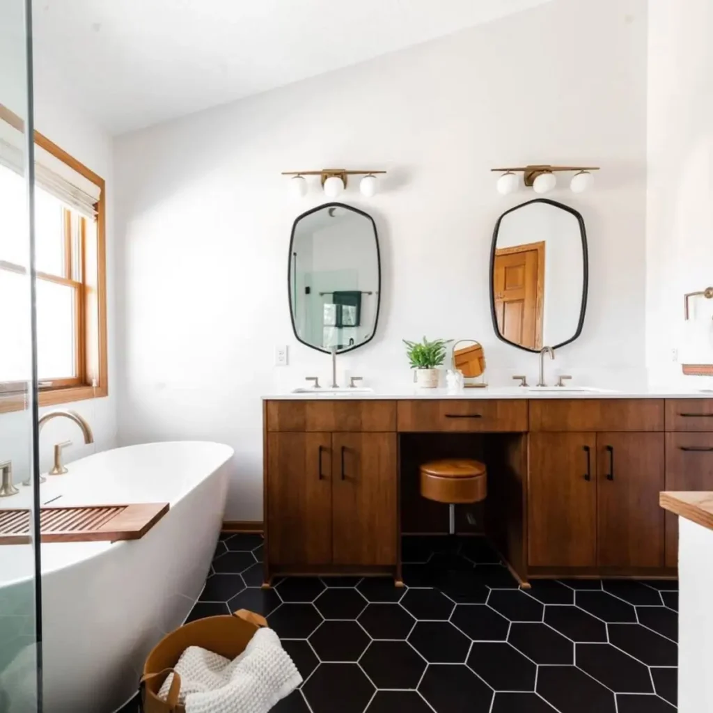 43 Mid Century Modern Small Bathroom Ideas for a Timeless Oasis (2025) 4 Walnut double vanity with black hexagonal floor tiles and brass fixtures in a mid century modern small bathroom.