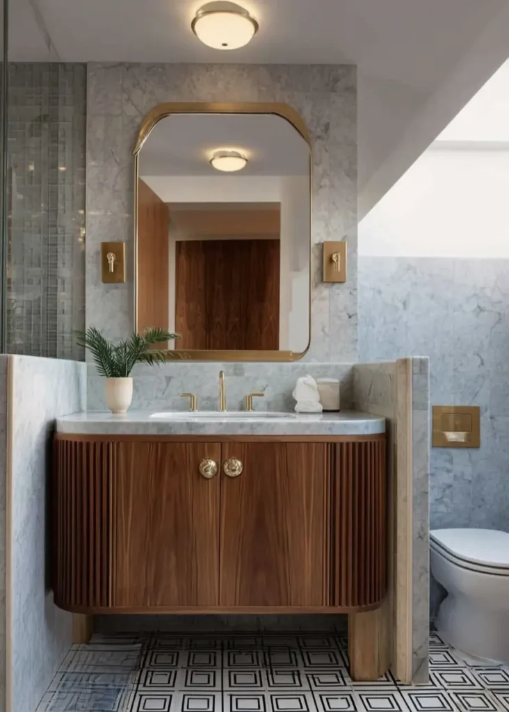 43 Mid Century Modern Small Bathroom Ideas for a Timeless Oasis (2025) 22 Fluted walnut vanity with marble walls and geometric floor tiles in a mid century small bathroom.