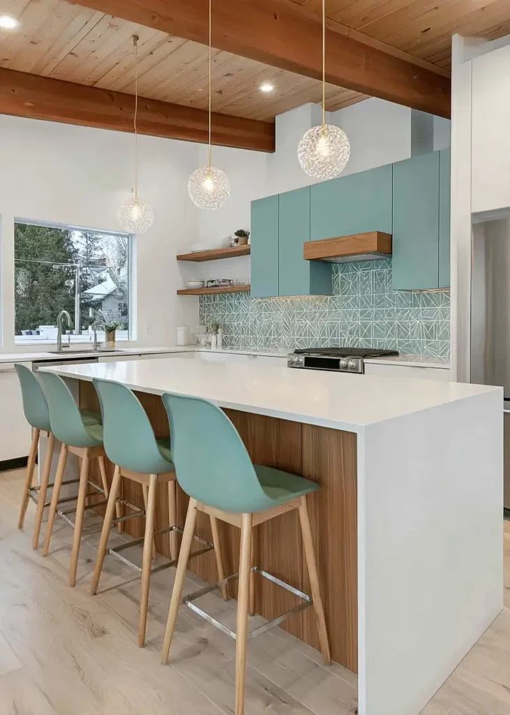 Bright kitchen with mid-century modern teal-green cabinets, matching bar stools, and a wood-beamed ceiling.