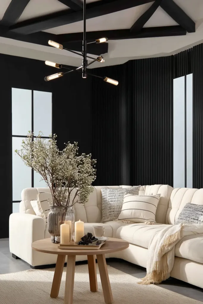 35 Scandinavian Living Room Ideas for a Cozy, Minimalist Home 23 Moody black wood slat walls contrasting with white sectional sofa in a modern Scandinavian living room.