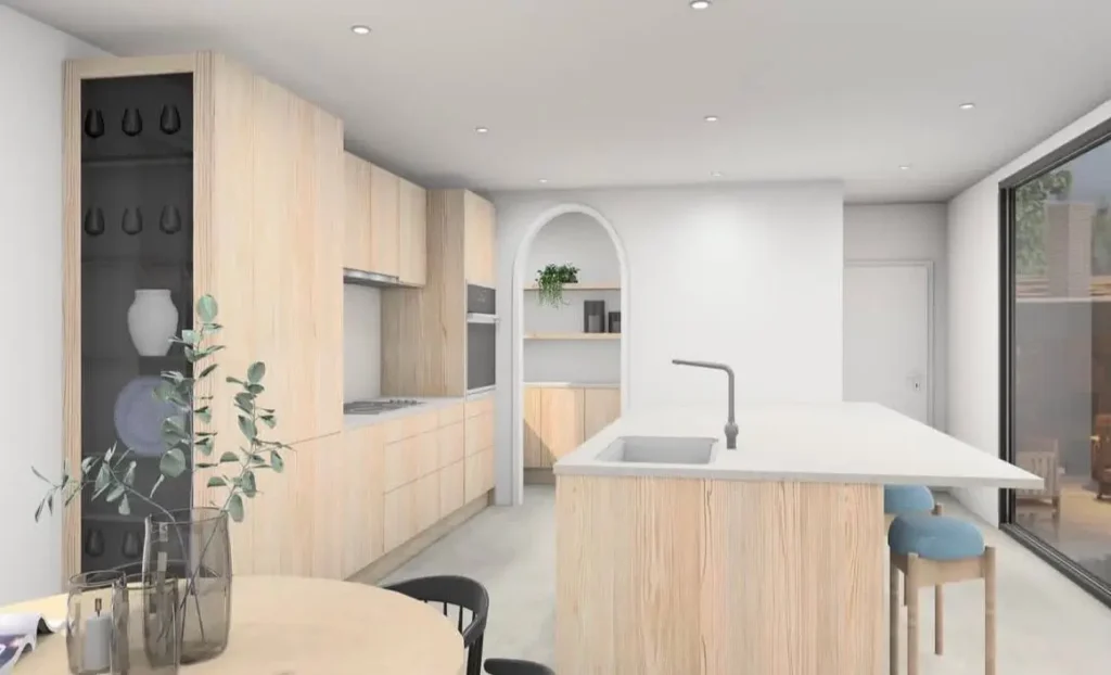 A Japanese inspired kitchen with pale wood cabinets, a white island, and a recessed arched nook.