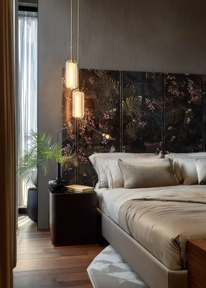 49 Headboard Design Ideas That Instantly Elevate Your Bedroom 28 Dark floral paneled headboard wall with modern gold pendant lights and neutral bedding.