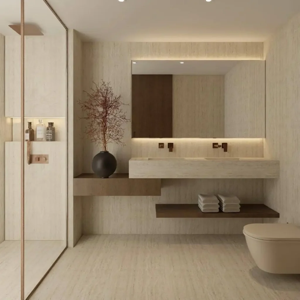 26 Japanese Bathroom Design Ideas for a Serene Home Oasis 28 A minimalist Japanese inspired bathroom with neutral stone tiles, a floating sink, and a wall-hung toilet.