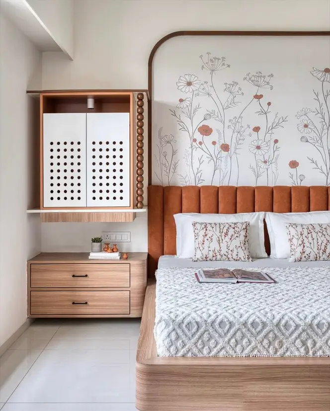 A modern Japanese-style bedroom featuring a botanical line-art mural, a low bed with a terracotta headboard, and a light wood nightstand.