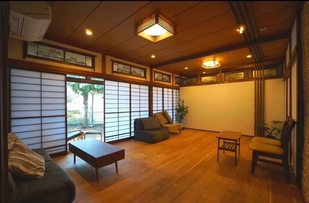 A modern Japanese style living room featuring tatami mats set into a hardwood floor for a hybrid look.