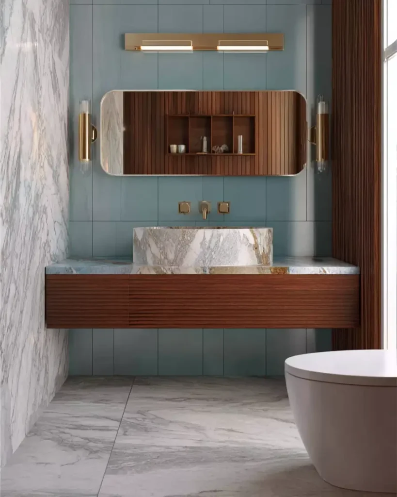 43 Mid Century Modern Small Bathroom Ideas for a Timeless Oasis (2025) 37 Floating walnut vanity with integrated mirror shelving and blue vertical tiles in a luxury bathroom.