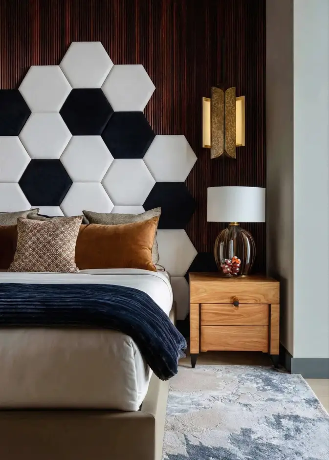 49 Headboard Design Ideas That Instantly Elevate Your Bedroom 42 Black and white hexagonal velvet panel headboard with asymmetrical honeycomb pattern.
