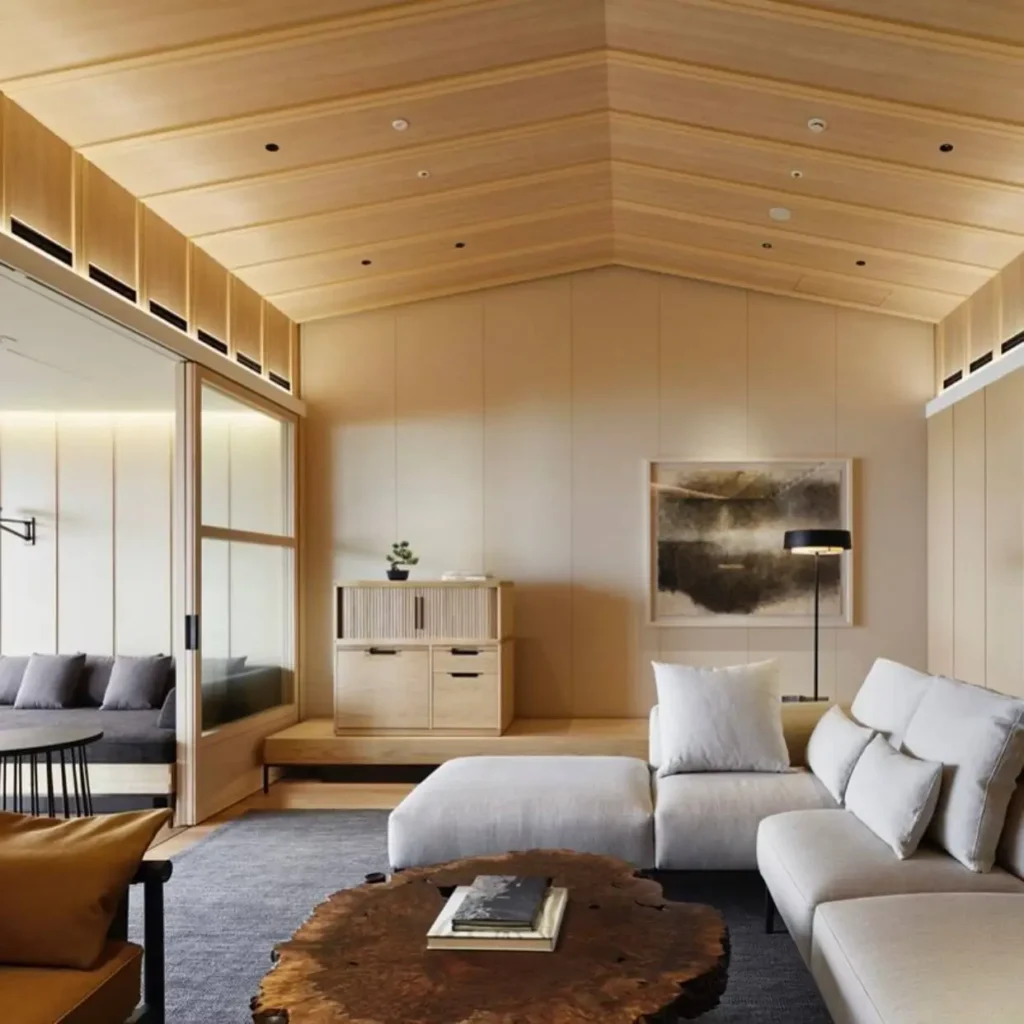 Modern Japanese living room with light wood walls and a live-edge coffee table.