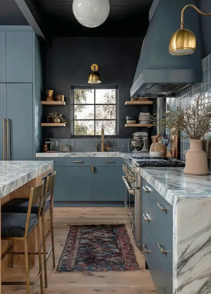 34 Modern Tudor Kitchen Ideas: Old-World Charm, New Appeal 12 Dark kitchen featuring blue lower cabinets, marble countertops, brass sconces, and a modern white globe pendant light.