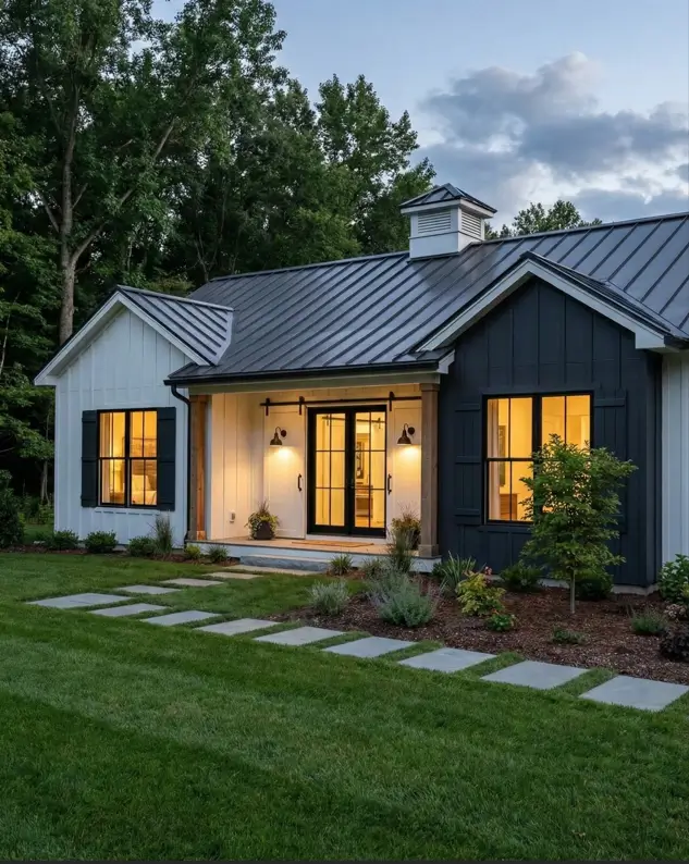 26 Small Ranch-Style House Ideas for Timeless Modern Living 17 White vertical siding and charcoal accents on a modern farmhouse style small Ranch house design with a cupola.