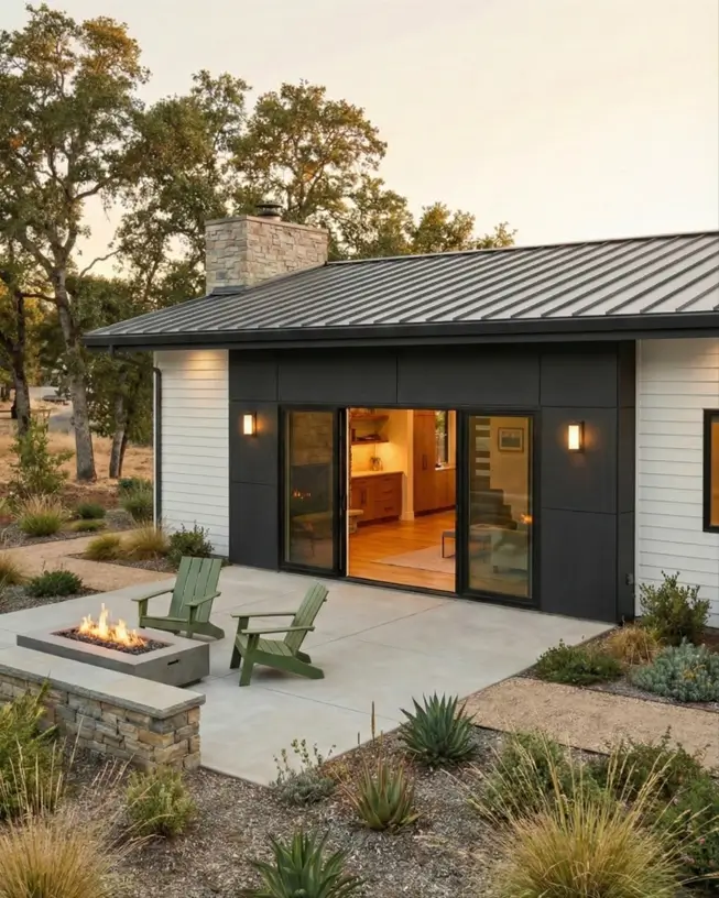 26 Small Ranch-Style House Ideas for Timeless Modern Living 21 Black and white color blocked exterior on a modern small Ranch house design with a concrete fire pit.
