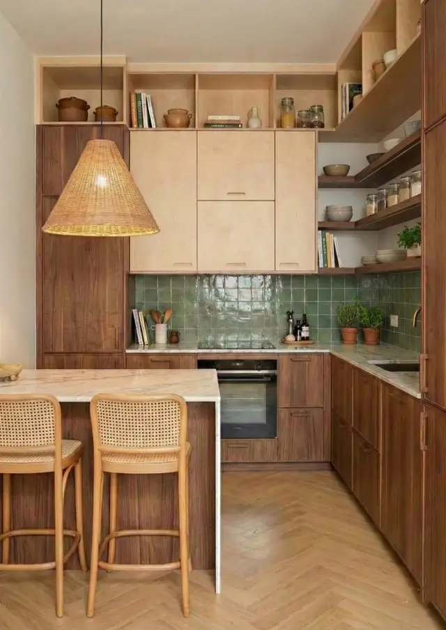 33 Small Scandinavian House Ideas That Prove Less Is More 32 Vertical storage kitchen with matte black floor-to-ceiling cabinetry and a light timber niche.