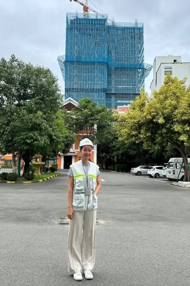 About Homeg 1 Fah Arinya, Interior Designer and Architect, conducting a site inspection at a high-rise construction project in Bangkok.